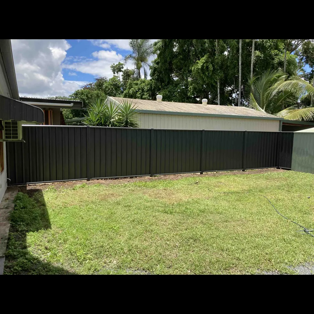 Charcoal Colorbond steel fence installation at a Cairns residential property